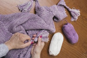 The second life… blanket. Stylish homemade pompoms and tassels!